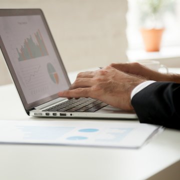 man on laptop accounting software 